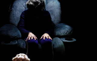elderly woman sitting alone